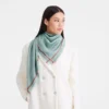 La Médaille Longchamp Shawl